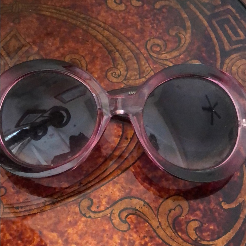 Plum colored knock off round Prada sunglasses